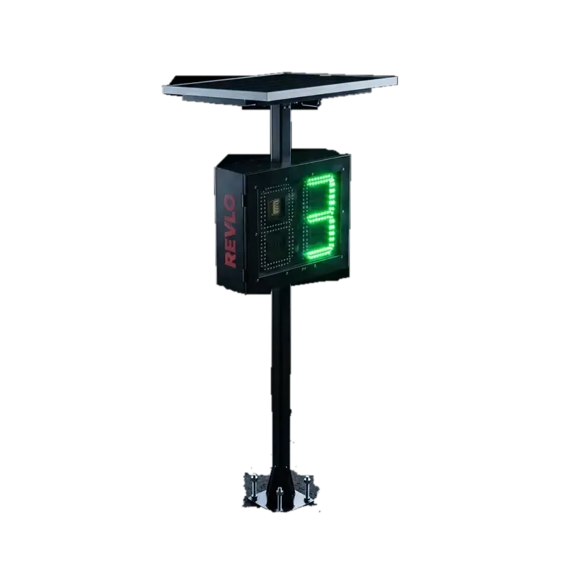 Lombada educativa Revlo acesa à noite: painel solar no topo, display de LED verde mostrando 3 e coluna chumbada